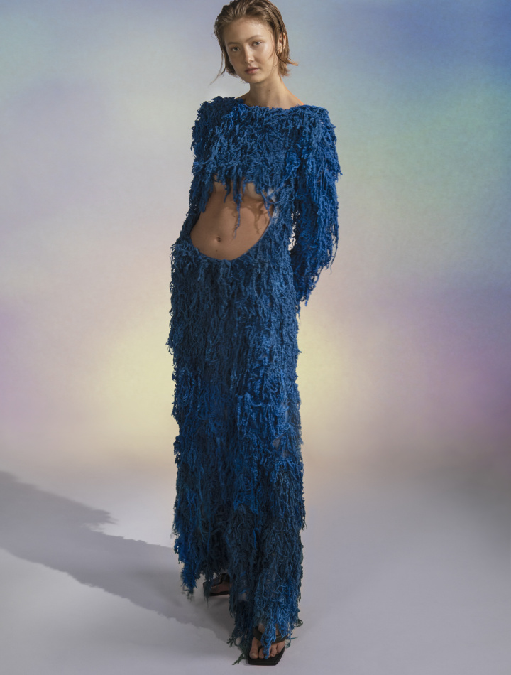 blue dress made with layers of fibers and loose hanging parts
