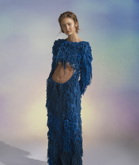 blue dress made with layers of fibers and loose hanging parts