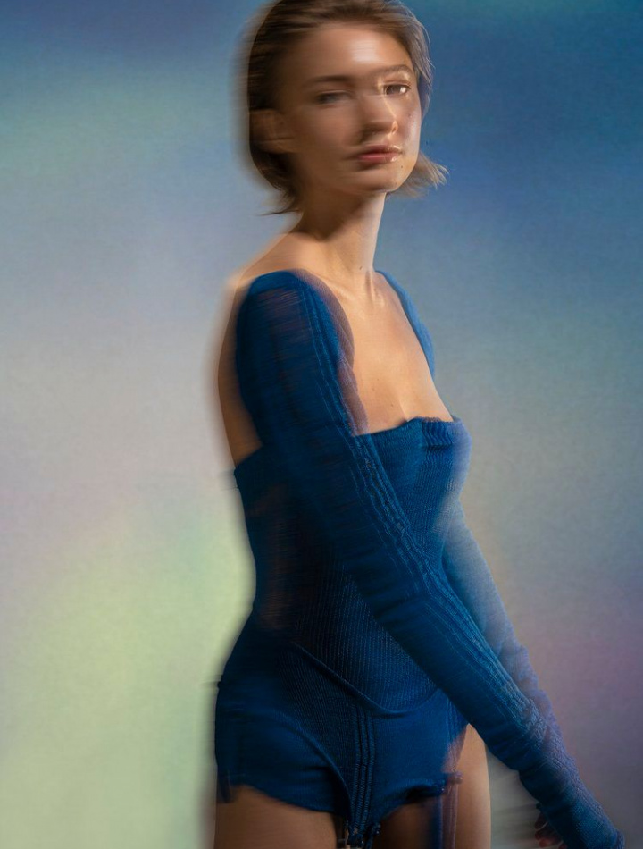 Blurry editorial of girl modelling blue bodysuit made by Filippa Fuxe